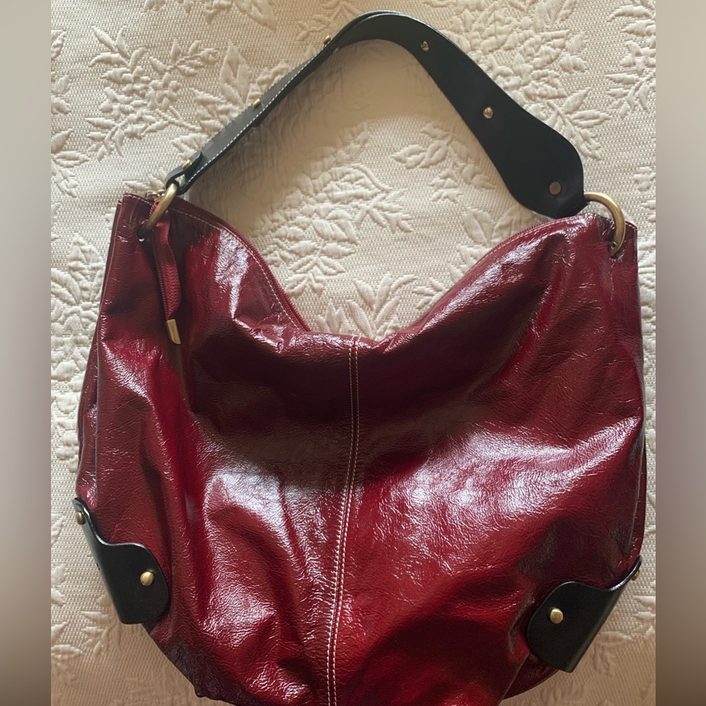 Large red and black leather bag In beautiful condition.